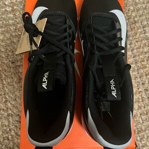 NEW !! Nike black cleats - never used